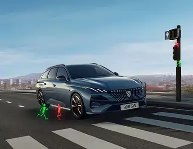 Modrosivé kombi Peugeot 308 SW na priechode pre chodcov v akcii Bežte ako o Peugeot v BEGAM Trnava